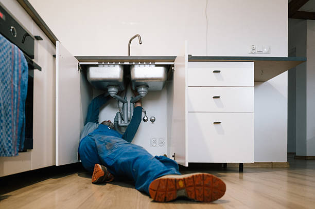 Professional Emergency Plumber technician working in Morrisonville, IL